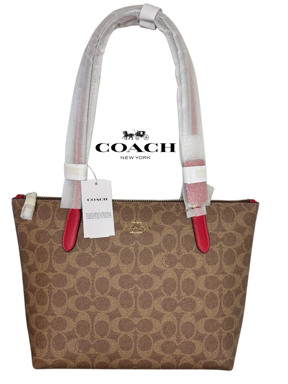 Coach Fiona Zip Tote in Signature Canvas with IM/Tan/Carnation color detailing.